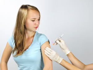 Teen girl getting a HPV vaccine
